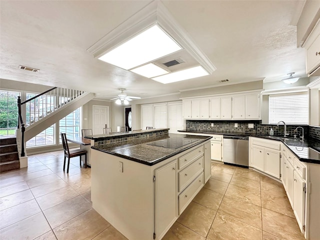 17439 Fairway Oaks Dr, Spring, TX 77379 - kitchen featuring dishwasher, a sink, black electric stovetop, a kitchen island, and decorative backsplash