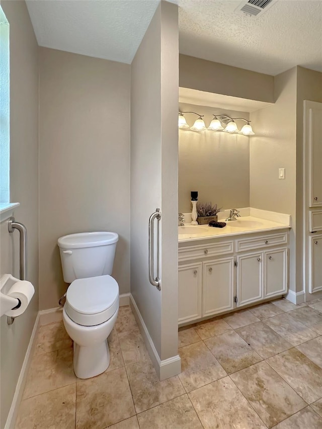 17439 Fairway Oaks Dr, Spring, TX 77379 - full bathroom featuring double vanity, tile patterned flooring, and a textured ceiling
