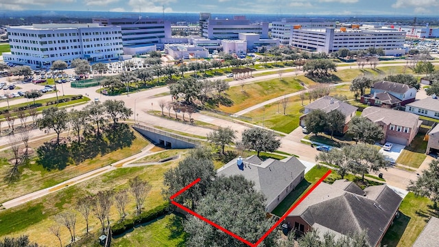 birds eye view of property featuring a view of city