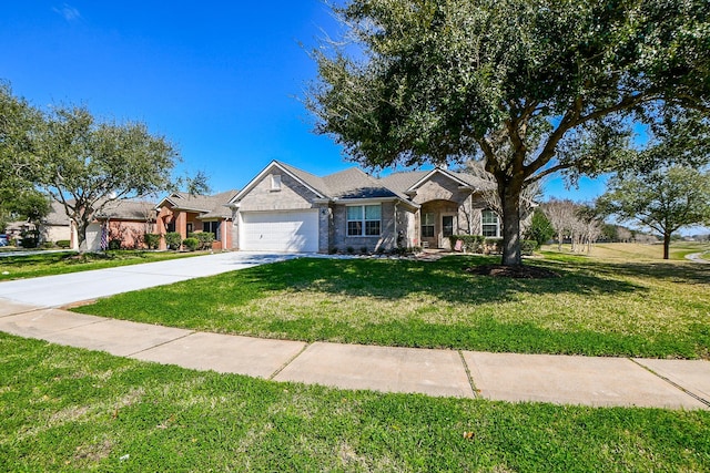 ranch-style home with an attached garage, brick siding, driveway, and a front yard