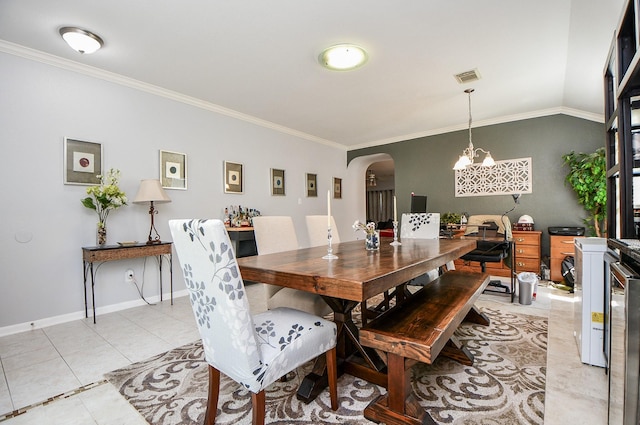 dining space featuring arched walkways, light tile patterned floors, visible vents, and crown molding