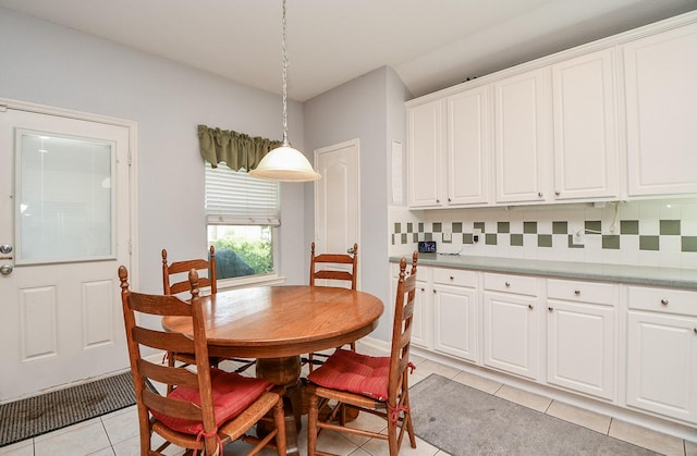 dining space with light tile patterned floors