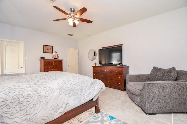 bedroom with visible vents, ceiling fan, and light tile patterned floors