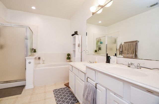 full bath with a garden tub, a shower stall, visible vents, and a sink