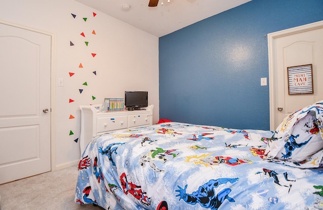 bedroom featuring light colored carpet and ceiling fan