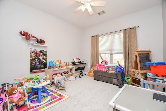 game room with visible vents, ceiling fan, and carpet flooring