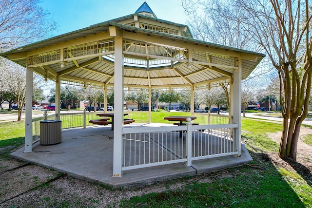 view of property's community with a yard and a gazebo