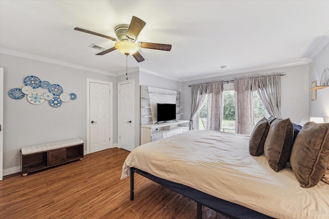 bedroom featuring crown molding, visible vents, a ceiling fan, wood finished floors, and baseboards