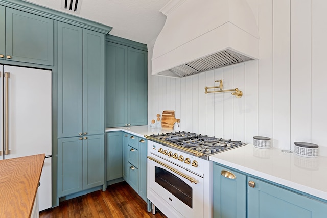 kitchen with white appliances, visible vents, dark wood-style floors, custom range hood, and light countertops