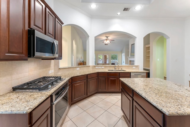 kitchen with light tile patterned floors, visible vents, appliances with stainless steel finishes, a sink, and ceiling fan