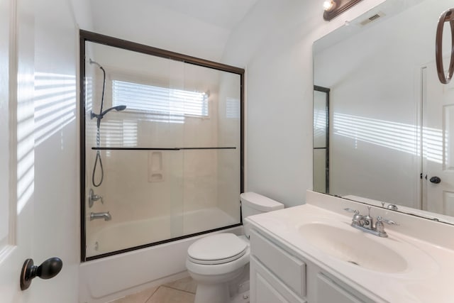 bathroom with visible vents, toilet, enclosed tub / shower combo, vanity, and tile patterned floors