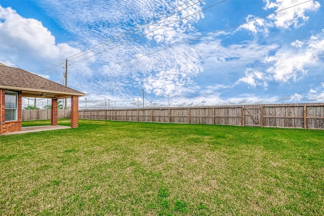 view of yard with a patio and a fenced backyard