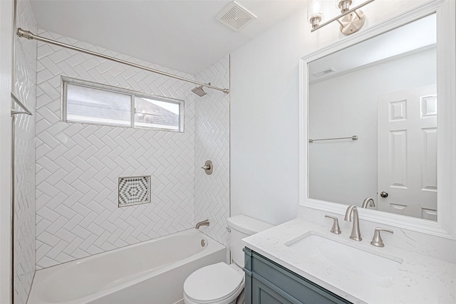 bathroom featuring toilet, bathing tub / shower combination, vanity, and visible vents