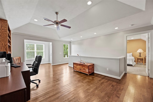 office area featuring baseboards, vaulted ceiling, wood finished floors, and recessed lighting