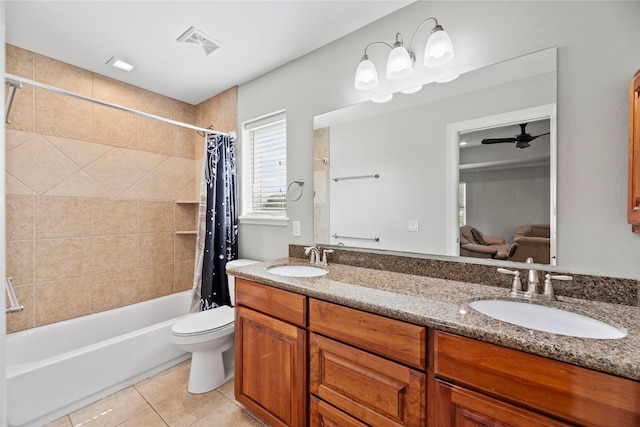 bathroom with shower / bath combo with shower curtain, tile patterned flooring, a sink, and visible vents