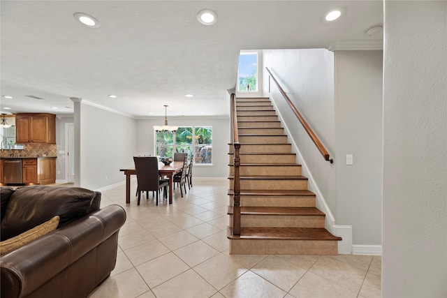 stairway with baseboards, ornamental molding, tile patterned flooring, and recessed lighting