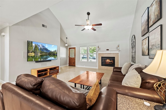 living room with high vaulted ceiling, light tile patterned flooring, visible vents, a ceiling fan, and a tiled fireplace