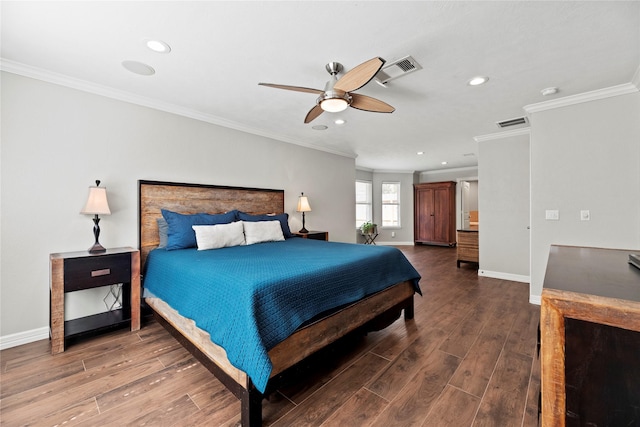 bedroom featuring ornamental molding, dark wood-style flooring, visible vents, and baseboards