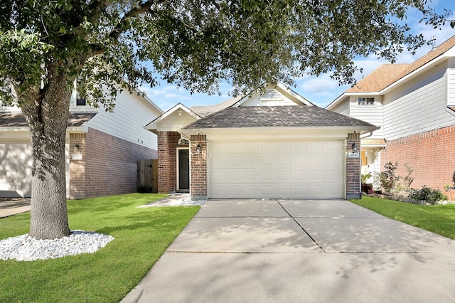 view of front of property featuring a garage, brick siding, concrete driveway, roof with shingles, and a front yard