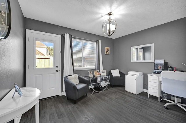 office area featuring dark wood-style floors, baseboards, and a textured ceiling