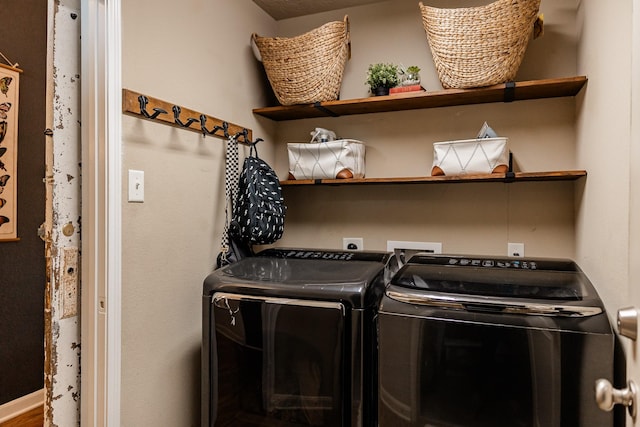 washroom featuring laundry area and independent washer and dryer