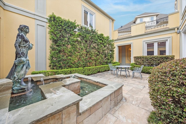 view of patio with a balcony