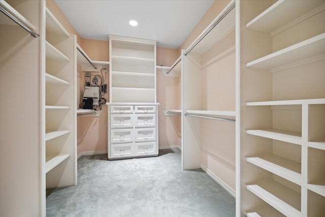 walk in closet featuring carpet