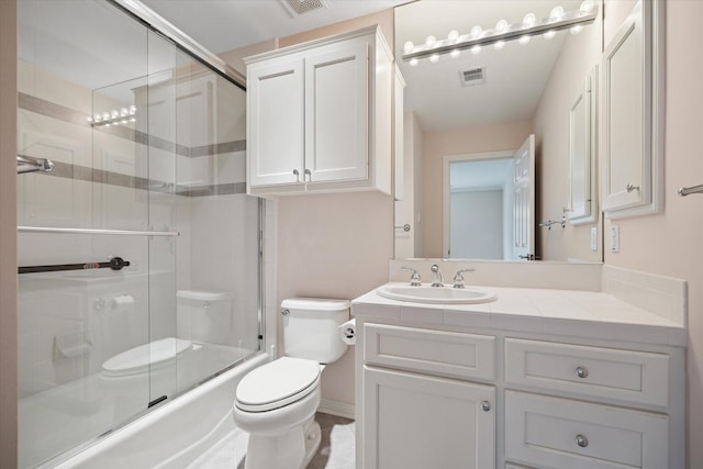 full bathroom with toilet, shower / bath combination with glass door, vanity, and visible vents