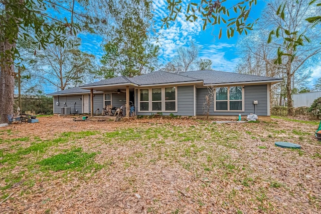 view of front of house with central AC unit and a ceiling fan