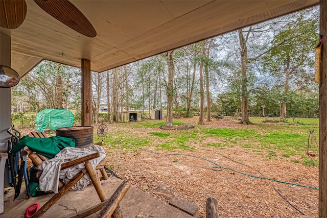 view of yard with ceiling fan