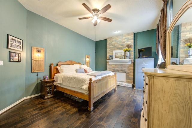 bedroom featuring ceiling fan, dark wood finished floors, and baseboards