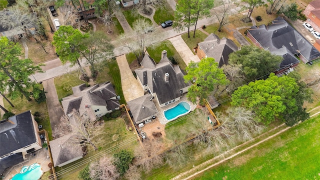 birds eye view of property with a residential view