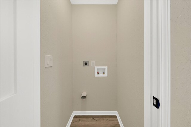 laundry area with laundry area, baseboards, wood finished floors, washer hookup, and electric dryer hookup