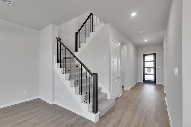 2920 Apple Rose, Katy, TX 77493 - foyer entrance with wood finished floors, visible vents, and baseboards