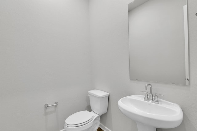 2920 Apple Rose, Katy, TX 77493 - bathroom with a sink, baseboards, and toilet