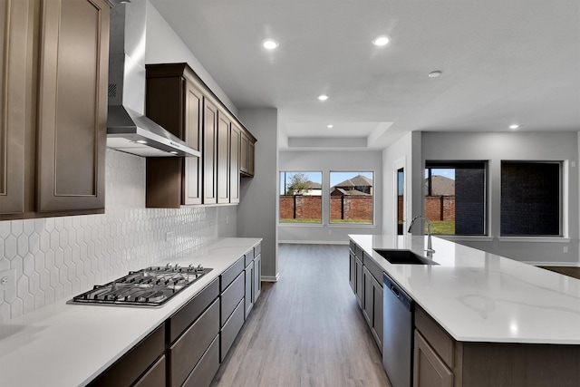 2920 Apple Rose, Katy, TX 77493 - kitchen featuring a sink, recessed lighting, stainless steel appliances, wall chimney exhaust hood, and decorative backsplash