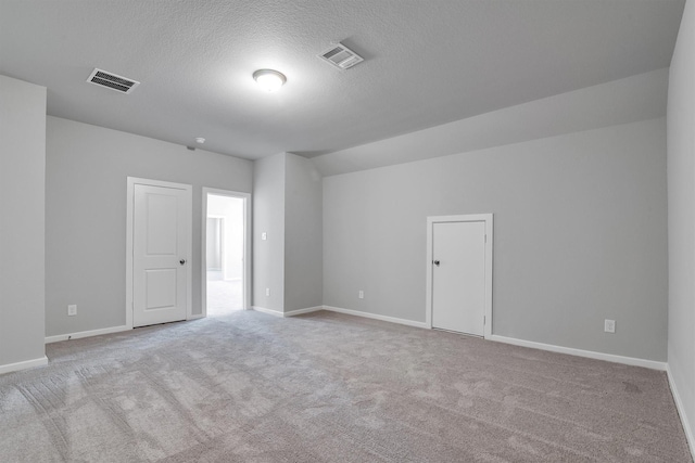2920 Apple Rose, Katy, TX 77493 - carpeted spare room with baseboards, visible vents, and a textured ceiling