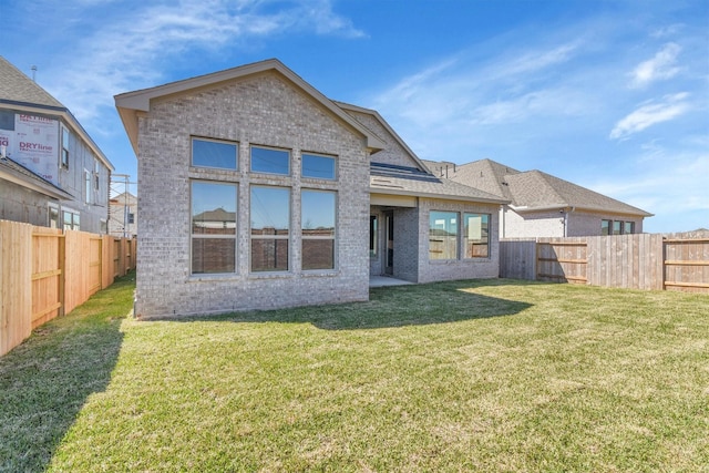 2920 Apple Rose, Katy, TX 77493 - rear view of house with a yard, a fenced backyard, and brick siding
