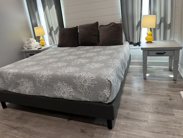 bedroom with wood finished floors