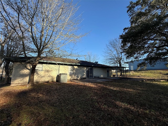 back of property with central AC unit