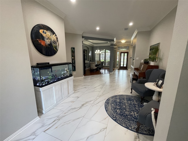 hallway with a notable chandelier, recessed lighting, baseboards, marble finish floor, and ornamental molding