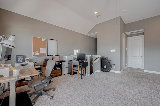 office with baseboards, visible vents, vaulted ceiling, and carpet flooring