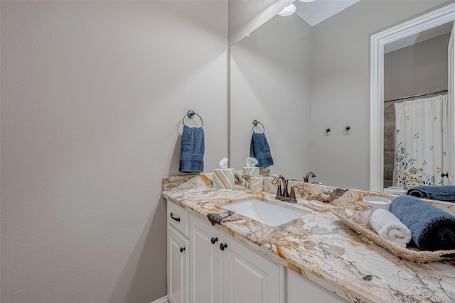 full bathroom featuring vanity and a shower with curtain