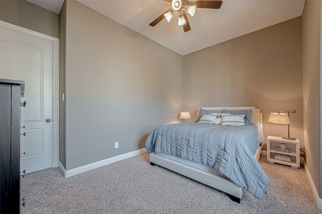 carpeted bedroom with lofted ceiling, ceiling fan, and baseboards