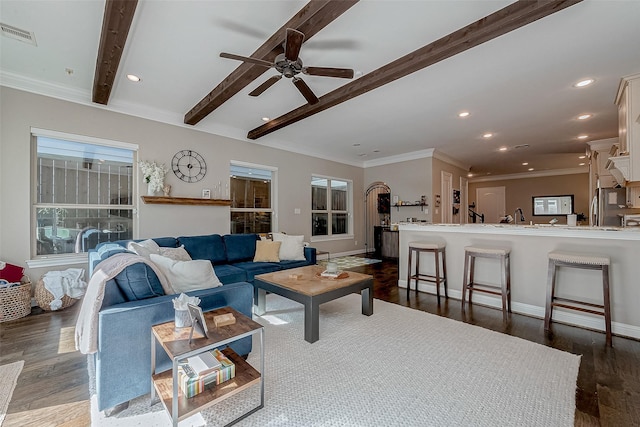 living area featuring beam ceiling, recessed lighting, visible vents, dark wood-type flooring, and baseboards