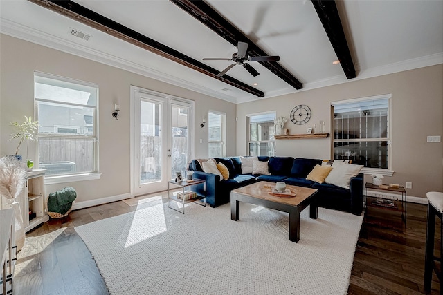 living room featuring beam ceiling, wood finished floors, visible vents, and baseboards