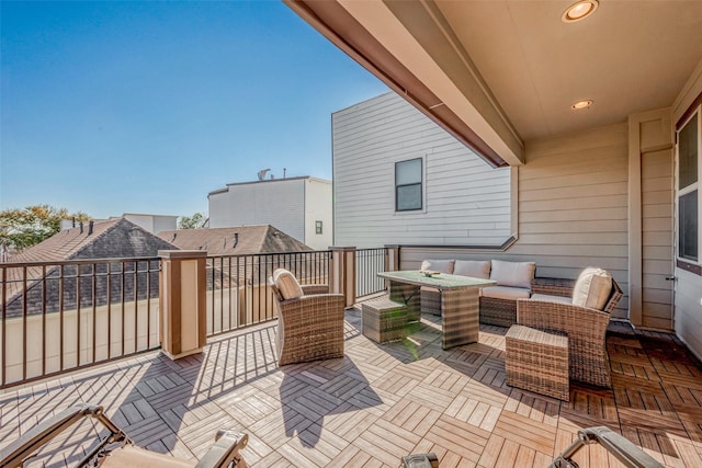 view of patio featuring outdoor lounge area and a balcony