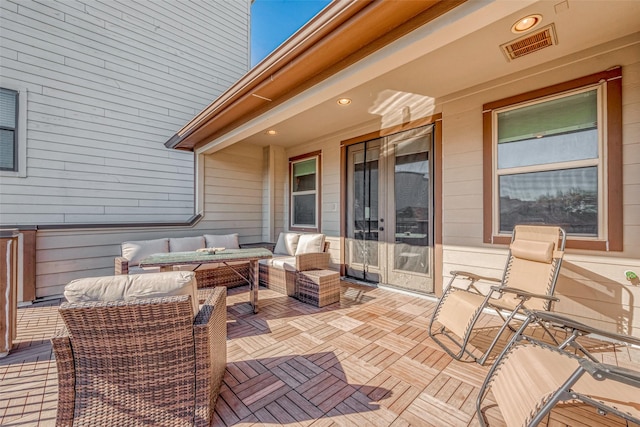 view of patio / terrace featuring visible vents and an outdoor living space