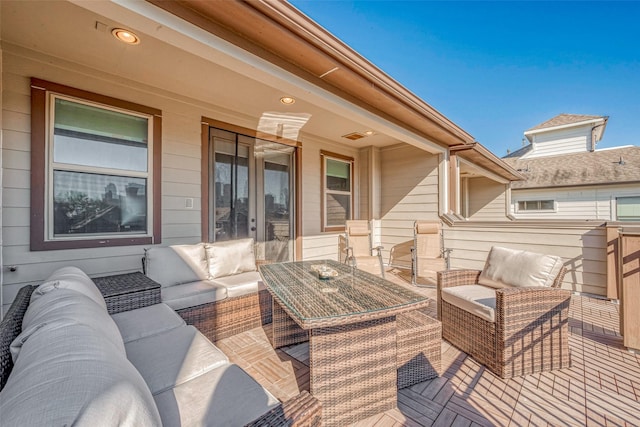 deck featuring an outdoor hangout area and french doors