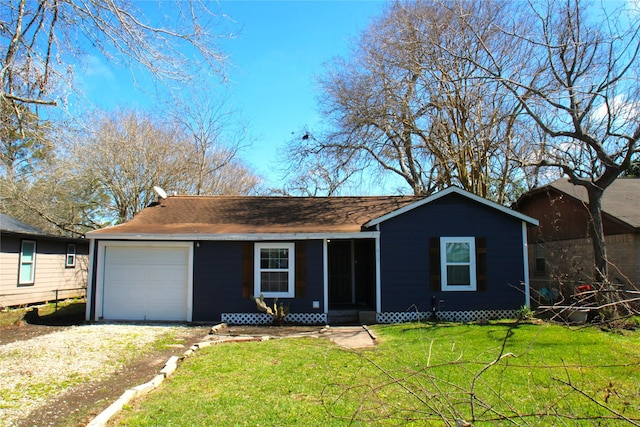 single story home with driveway and a front yard